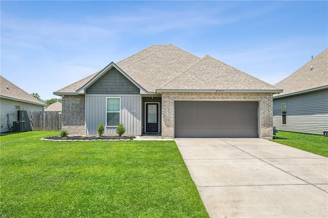 view of front of property featuring board and batten siding, brick siding, a garage, a shingled roof, and driveway
