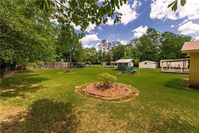 view of yard with a storage shed, an outbuilding, and view of scattered trees