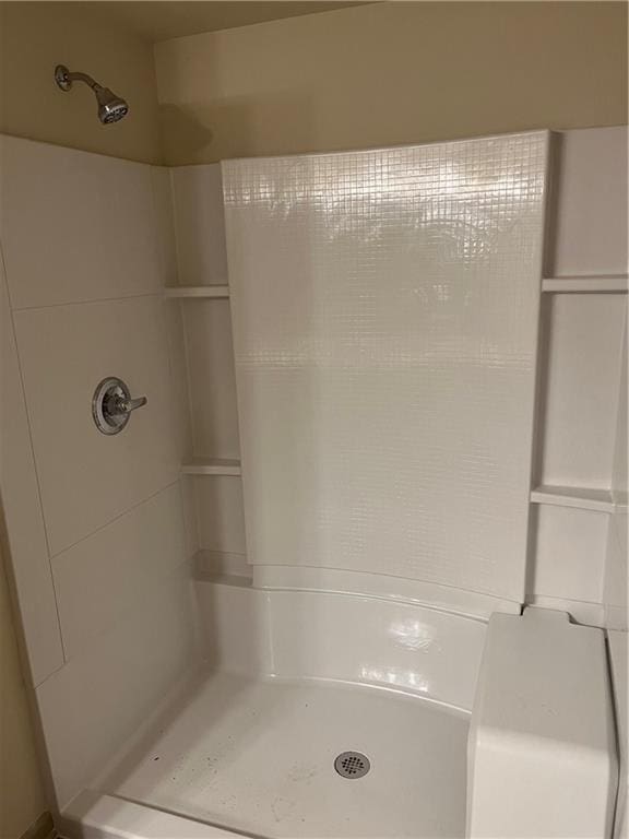 bathroom with a shower stall