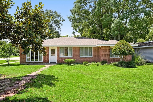389 Hickory Dr, Slidell, LA 70458 - ranch-style house with a front lawn and brick siding