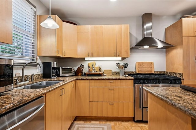 389 Hickory Dr, Slidell, LA 70458 - kitchen featuring wall chimney range hood, appliances with stainless steel finishes, a sink, and dark stone countertops