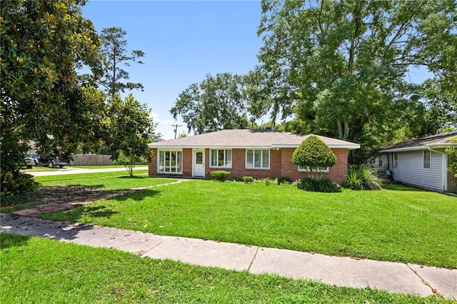 389 Hickory Dr, Slidell, LA 70458 - ranch-style house with a front lawn and brick siding