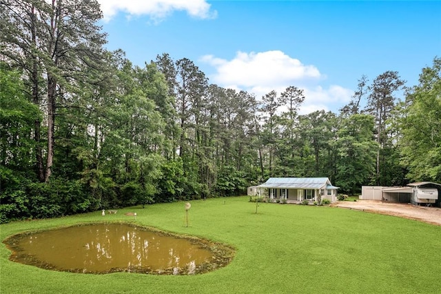 14356 Oak St, Tickfaw, LA 70466 - view of green lawn with a view of trees and driveway