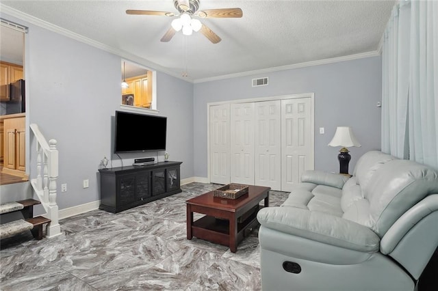 14356 Oak St, Tickfaw, LA 70466 - living area featuring a ceiling fan, a textured ceiling, light marble finish floors, ornamental molding, and baseboards