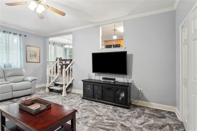 14356 Oak St, Tickfaw, LA 70466 - living area with ceiling fan, ornamental molding, marble finish floors, baseboards, and a chandelier