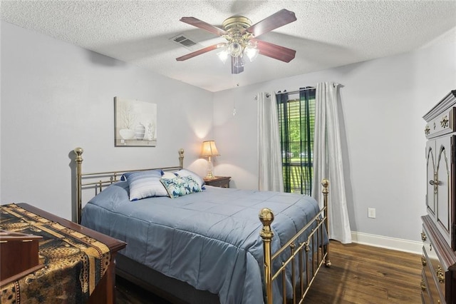 14356 Oak St, Tickfaw, LA 70466 - bedroom featuring wood finished floors, baseboards, a textured ceiling, and a ceiling fan