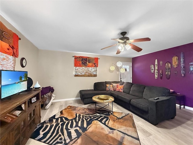 58207 Jefferson Ave, Slidell, LA 70460 - living area featuring wood finished floors, a ceiling fan, and baseboards