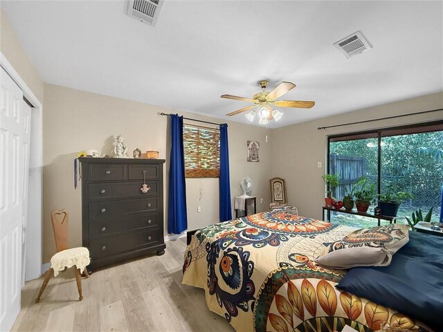 58207 Jefferson Ave, Slidell, LA 70460 - bedroom featuring light wood finished floors, access to exterior, a closet, ceiling fan, and baseboards