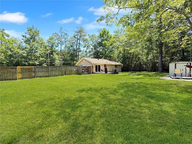 58207 Jefferson Ave, Slidell, LA 70460 - view of yard featuring an outdoor structure and a storage unit
