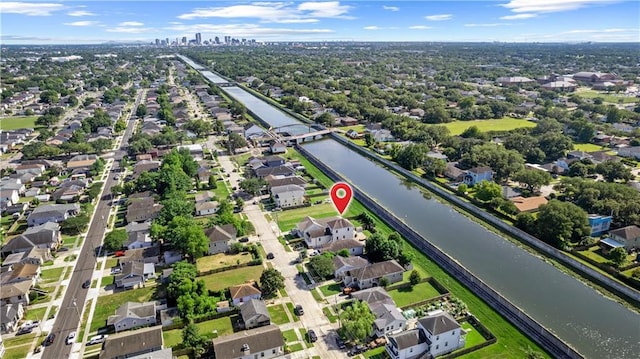 aerial view of property's location featuring nearby suburban area and a nearby body of water