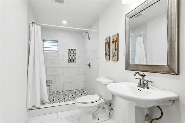 2152 Pebble Beach Dr, La Place, LA 70068 - full bath with toilet, a shower stall, marble finish flooring, baseboards, and a sink