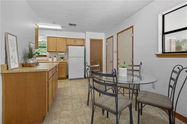 104 Maple Ridge Dr, Slidell, LA 70460 - dining space featuring a textured ceiling