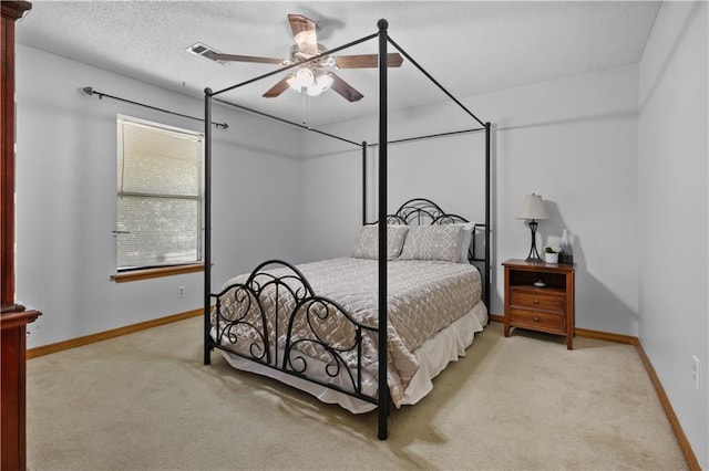 104 Maple Ridge Dr, Slidell, LA 70460 - bedroom with carpet, baseboards, a ceiling fan, and a textured ceiling