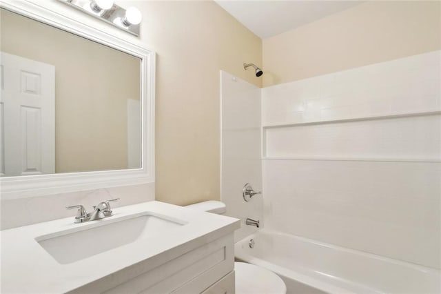 bathroom with toilet, shower / bath combination, and vanity