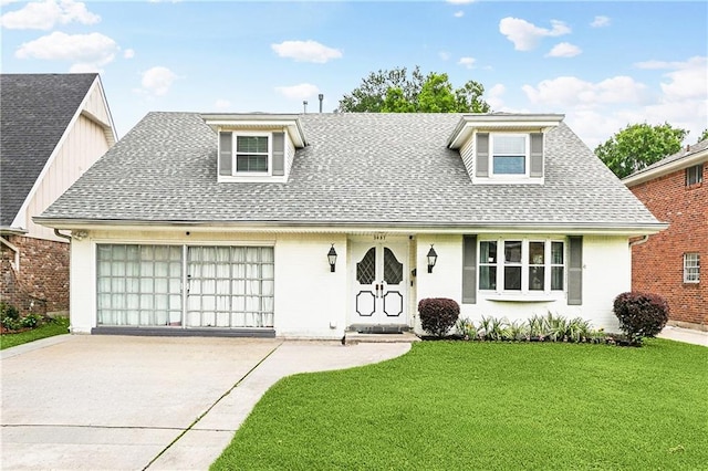 5037 Tartan Dr, Metairie, LA 70003 - view of front of house featuring concrete driveway, a shingled roof, an attached garage, and a front yard