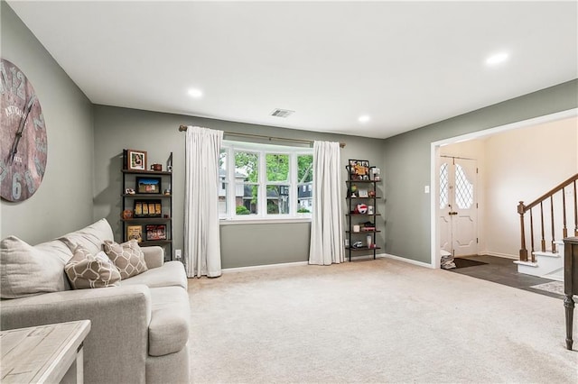 5037 Tartan Dr, Metairie, LA 70003 - carpeted living room featuring stairs, baseboards, and recessed lighting