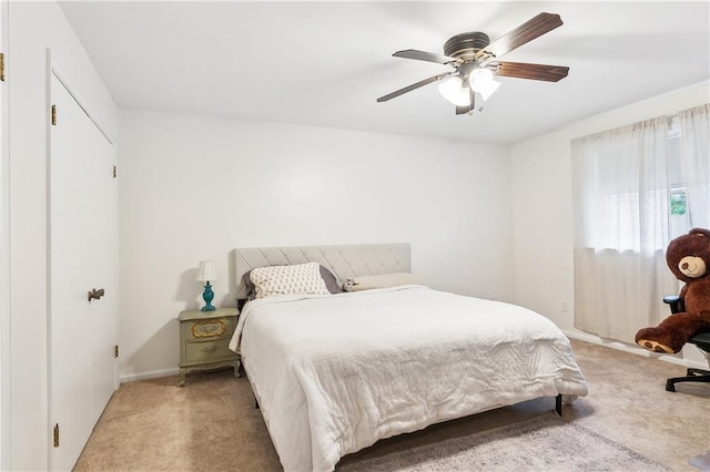 5037 Tartan Dr, Metairie, LA 70003 - bedroom featuring light colored carpet, ceiling fan, and baseboards
