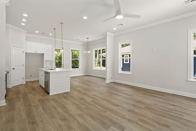 2441 Dupard St, Mandeville, LA 70448 - kitchen with plenty of natural light, light wood-type flooring, a ceiling fan, recessed lighting, and crown molding