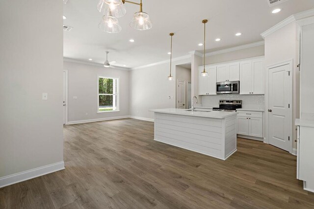 2441 Dupard St, Mandeville, LA 70448 - kitchen featuring stainless steel appliances, ornamental molding, baseboards, decorative backsplash, and recessed lighting