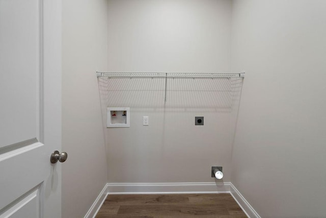 2441 Dupard St, Mandeville, LA 70448 - laundry area featuring electric dryer hookup, washer hookup, dark wood finished floors, and baseboards