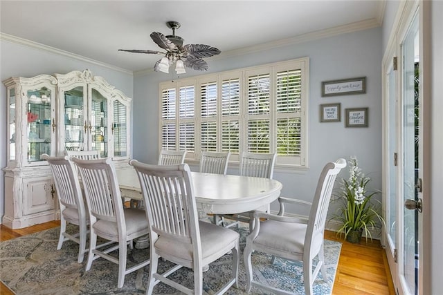 228 Marlin Dr, Slidell, LA 70461 - dining area with wood finished floors, a ceiling fan, ornamental molding, and baseboards
