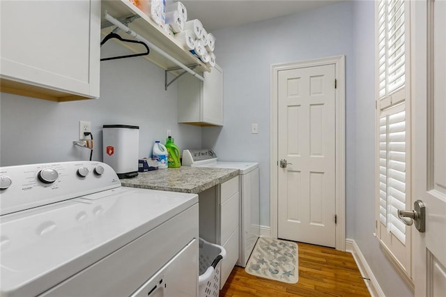 228 Marlin Dr, Slidell, LA 70461 - laundry room with cabinet space, washing machine and clothes dryer, wood finished floors, and baseboards