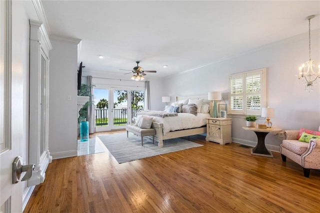 228 Marlin Dr, Slidell, LA 70461 - bedroom featuring access to outside, crown molding, multiple windows, wood finished floors, and recessed lighting