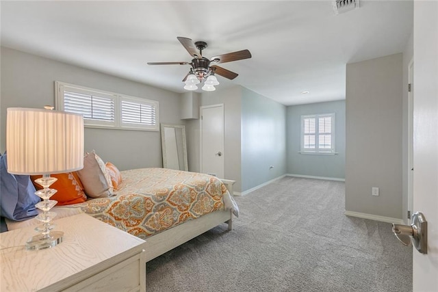 228 Marlin Dr, Slidell, LA 70461 - bedroom with multiple windows, carpet flooring, baseboards, and ceiling fan