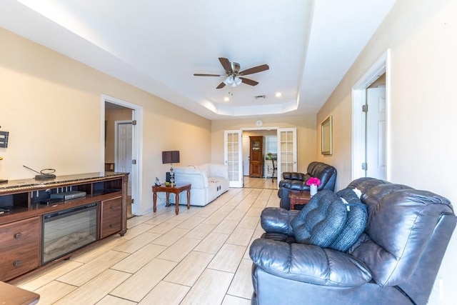 4624 Wright Rd, New Orleans, LA 70128 - living area featuring a raised ceiling, ceiling fan, french doors, and recessed lighting