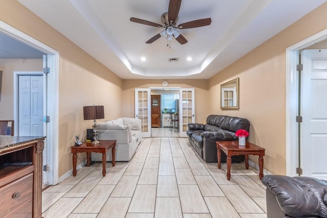 4624 Wright Rd, New Orleans, LA 70128 - living room with a ceiling fan, a raised ceiling, baseboards, and recessed lighting