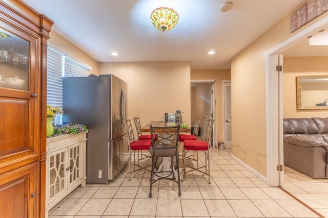 dining area with light tile patterned floors, recessed lighting, and baseboards