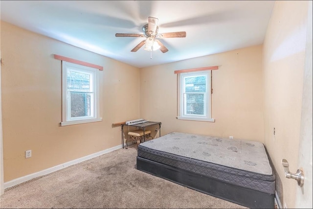 4624 Wright Rd, New Orleans, LA 70128 - carpeted bedroom with baseboards and a ceiling fan