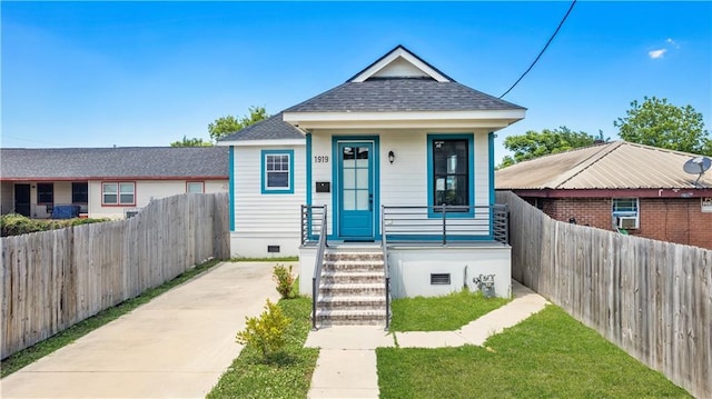 1919 N Prieur St, New Orleans, LA 70116 - view of front of house featuring fence and a shingled roof