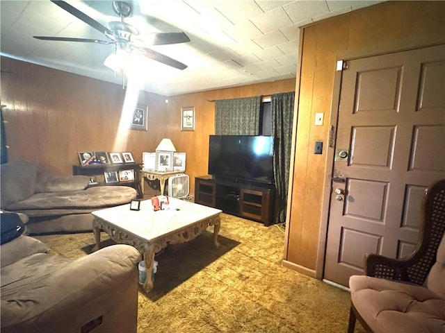 134B First St, Boutte, LA 70039 - living area featuring ceiling fan, carpet flooring, and wooden walls