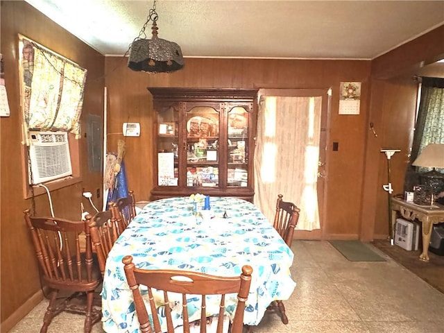 134B First St, Boutte, LA 70039 - dining room with wood walls, cooling unit, and a chandelier