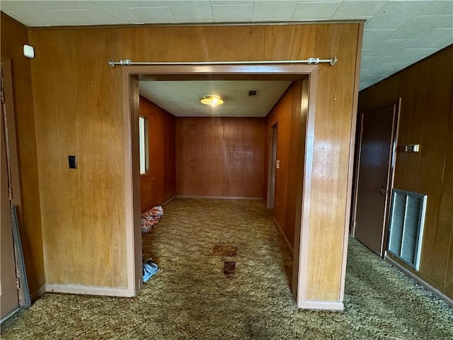 134B First St, Boutte, LA 70039 - corridor featuring carpet flooring and wooden walls