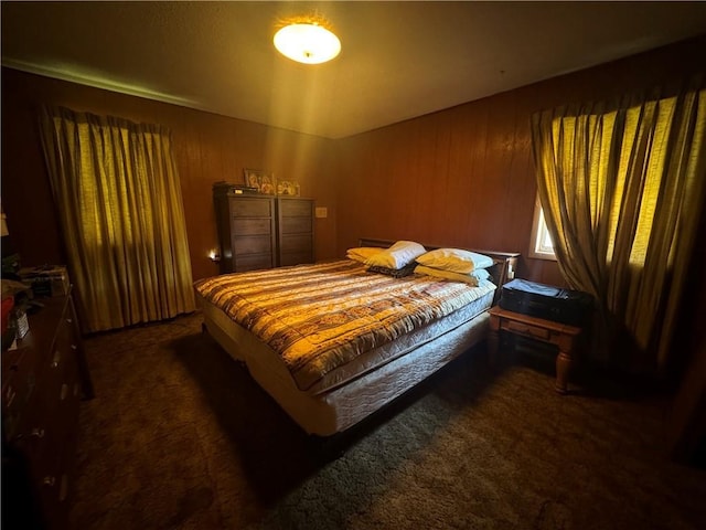 134B First St, Boutte, LA 70039 - bedroom featuring dark carpet and wood walls