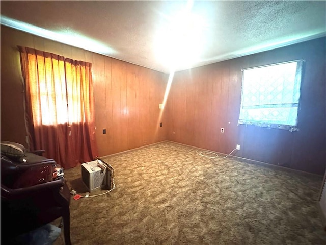 134B First St, Boutte, LA 70039 - carpeted spare room featuring a textured ceiling and wood walls