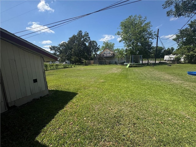 134B First St, Boutte, LA 70039 - view of grassy yard featuring a trampoline