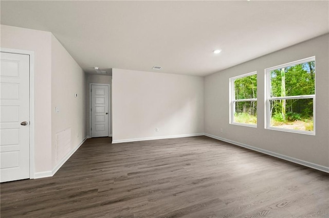 24231 Gadwall Ave, Ponchatoula, LA 70454 - spare room featuring dark wood-type flooring, baseboards, and recessed lighting