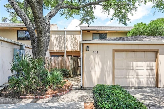107 10th St Unit 107, New Orleans, LA 70124 - garage featuring fence and driveway