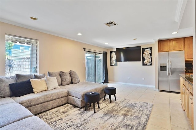 107 10th St Unit 107, New Orleans, LA 70124 - living area with light tile patterned floors, healthy amount of natural light, recessed lighting, crown molding, and baseboards