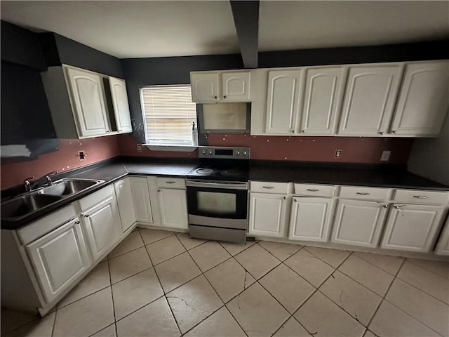 kitchen with stainless steel electric range oven, a sink, white cabinets, dark countertops, and light tile patterned flooring