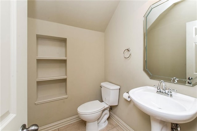 17181 Bridle Path, Hammond, LA 70403 - half bathroom with baseboards, a sink, toilet, and tile patterned flooring