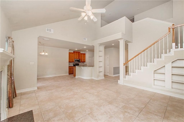 17181 Bridle Path, Hammond, LA 70403 - unfurnished living room featuring ceiling fan, high vaulted ceiling, ornate columns, stairs, and light tile patterned flooring