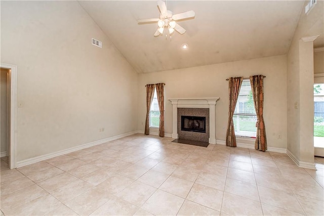 17181 Bridle Path, Hammond, LA 70403 - unfurnished living room with vaulted ceiling, ceiling fan, light tile patterned floors, a fireplace with flush hearth, and baseboards