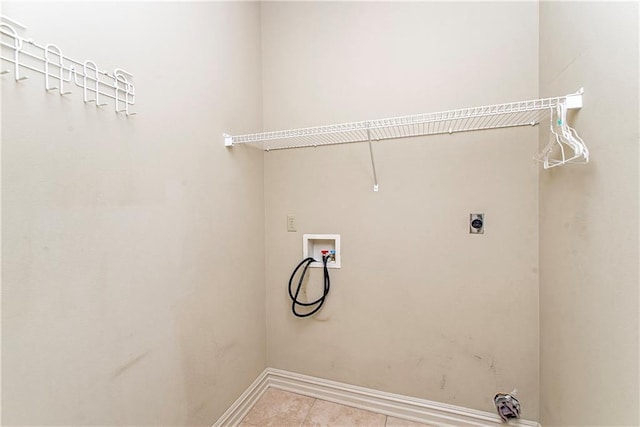 17181 Bridle Path, Hammond, LA 70403 - laundry room with washer hookup, hookup for an electric dryer, baseboards, and light tile patterned floors