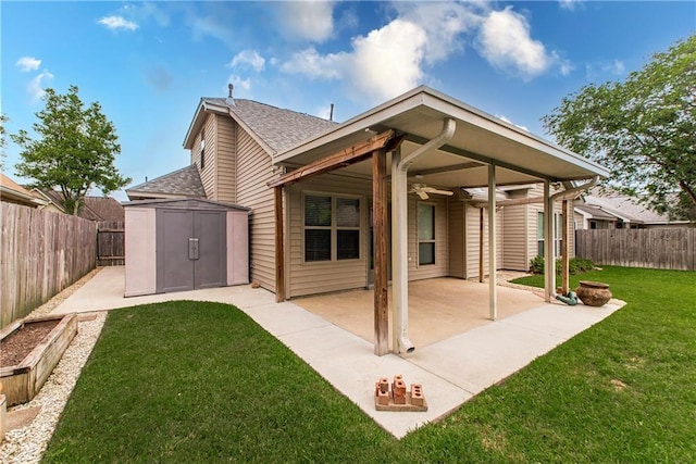 17181 Bridle Path, Hammond, LA 70403 - back of property featuring a ceiling fan, a storage unit, a patio, a shingled roof, and an outdoor structure