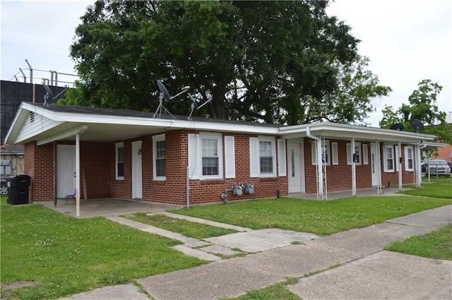 4133 Pauger St, New Orleans, LA 70122 - ranch-style home with a front yard, brick siding, a carport, and a porch