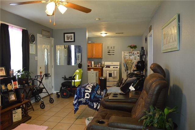 4133 Pauger St, New Orleans, LA 70122 - living area featuring light tile patterned floors and ceiling fan